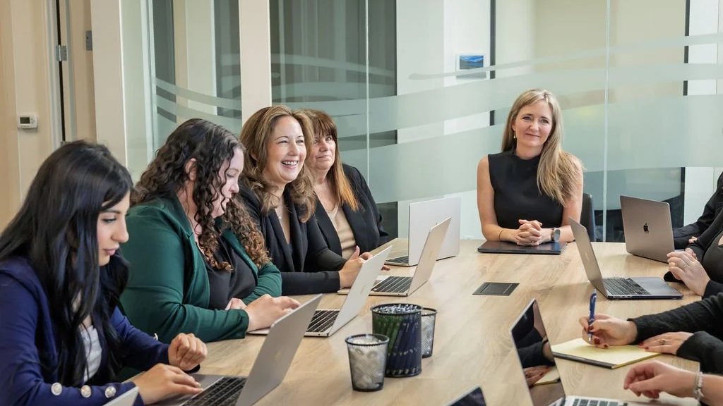 Conference room at a Tresp Law, APC office, with a long table and a view of the California coast